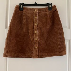 Super cute brown corduroy mini skirt with brass snaps